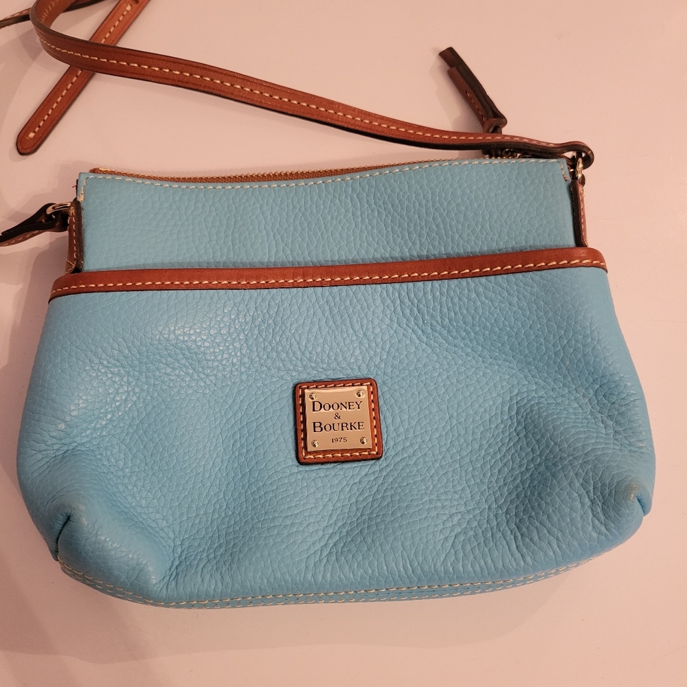 Turquoise Dooney & Bourke over the shoulder purse.